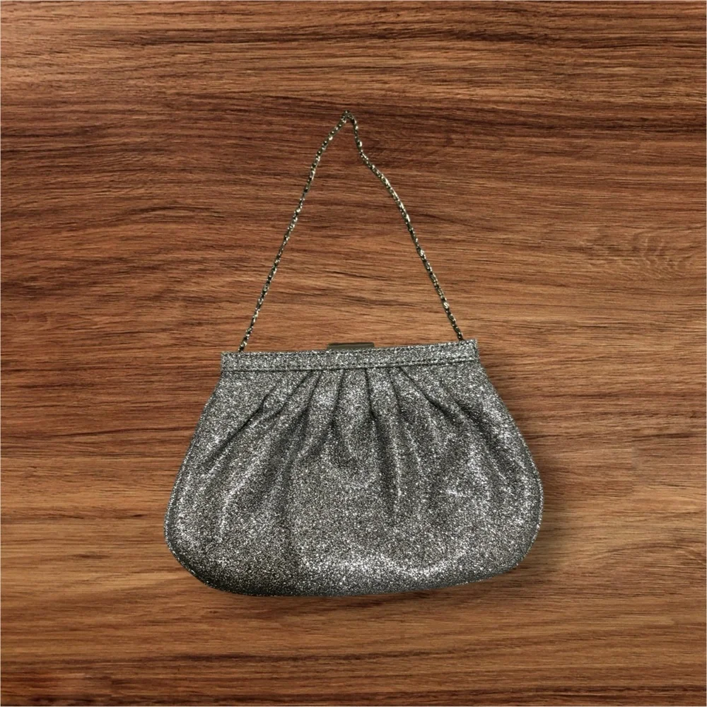 Miss KG Clutch with Chain Strap and a Bow Accent on the Front Silver